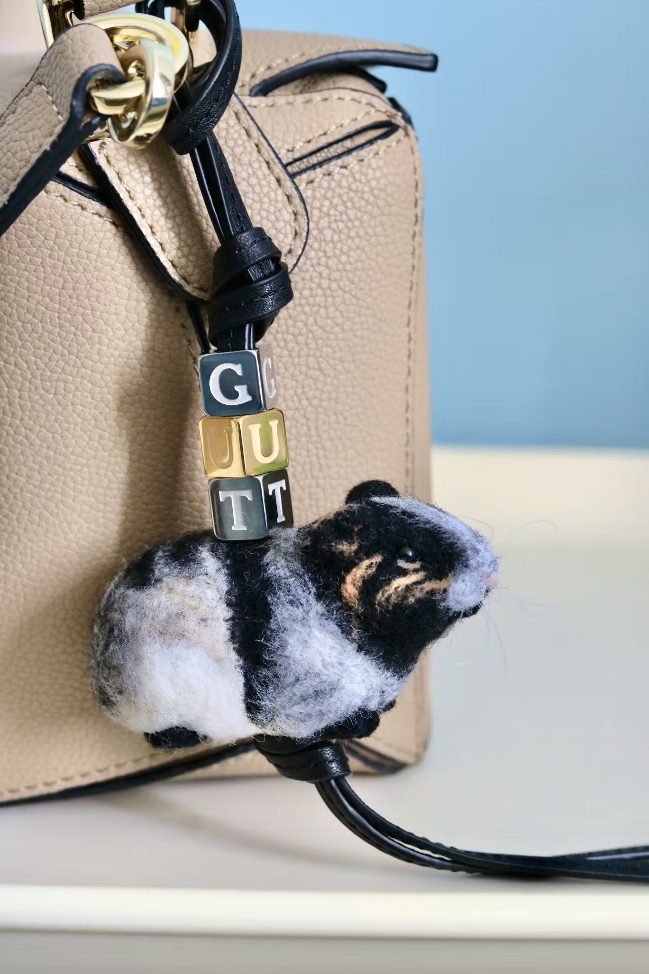 Custom felt mouse ornament hanging on bag as charm