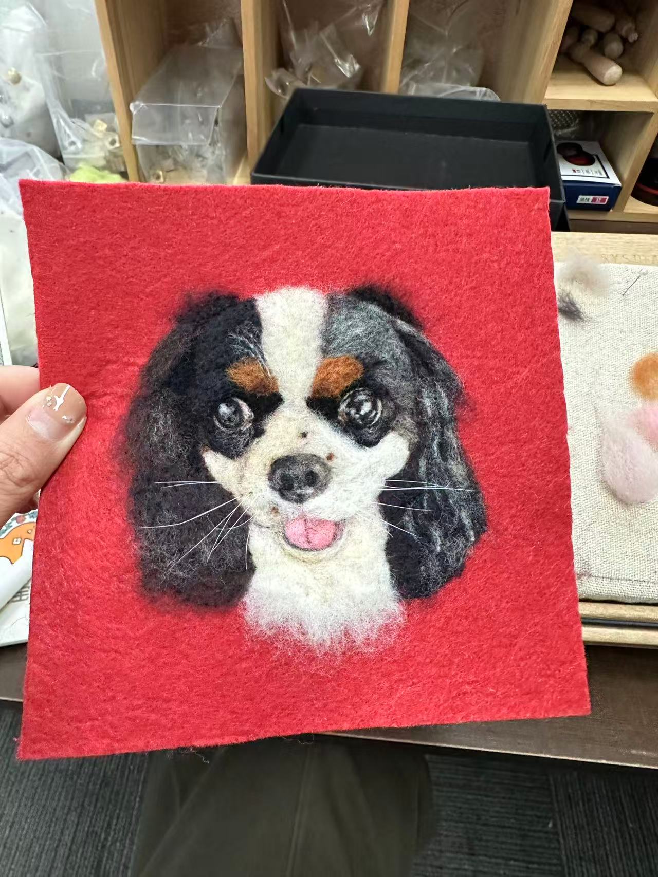 Pet portrait artist at work - handmade wool felt pet portrait in progress with wool