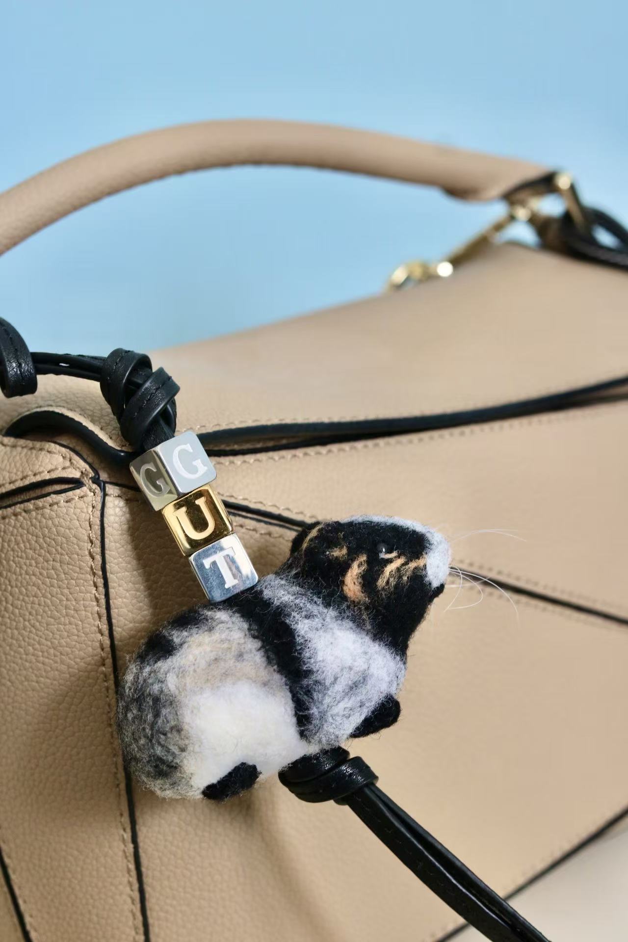 Custom felt mouse ornament hanging on bag as charm